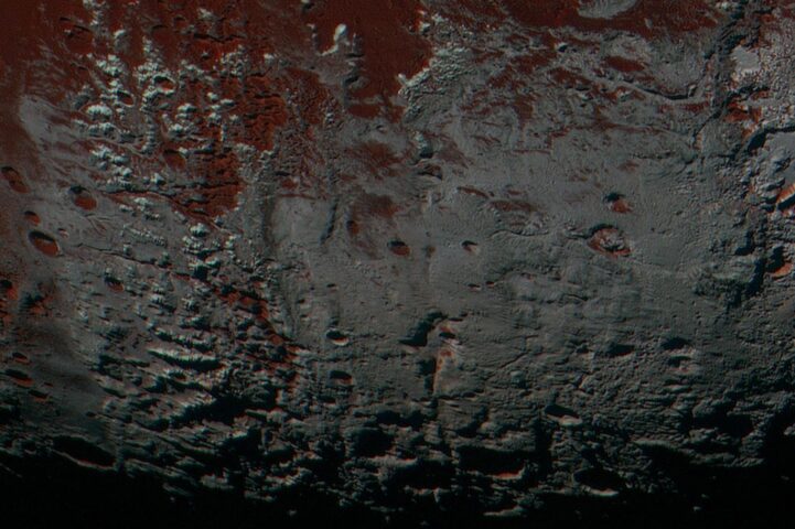 Pluto's Methane Snowcaps on the Edge of Darkness